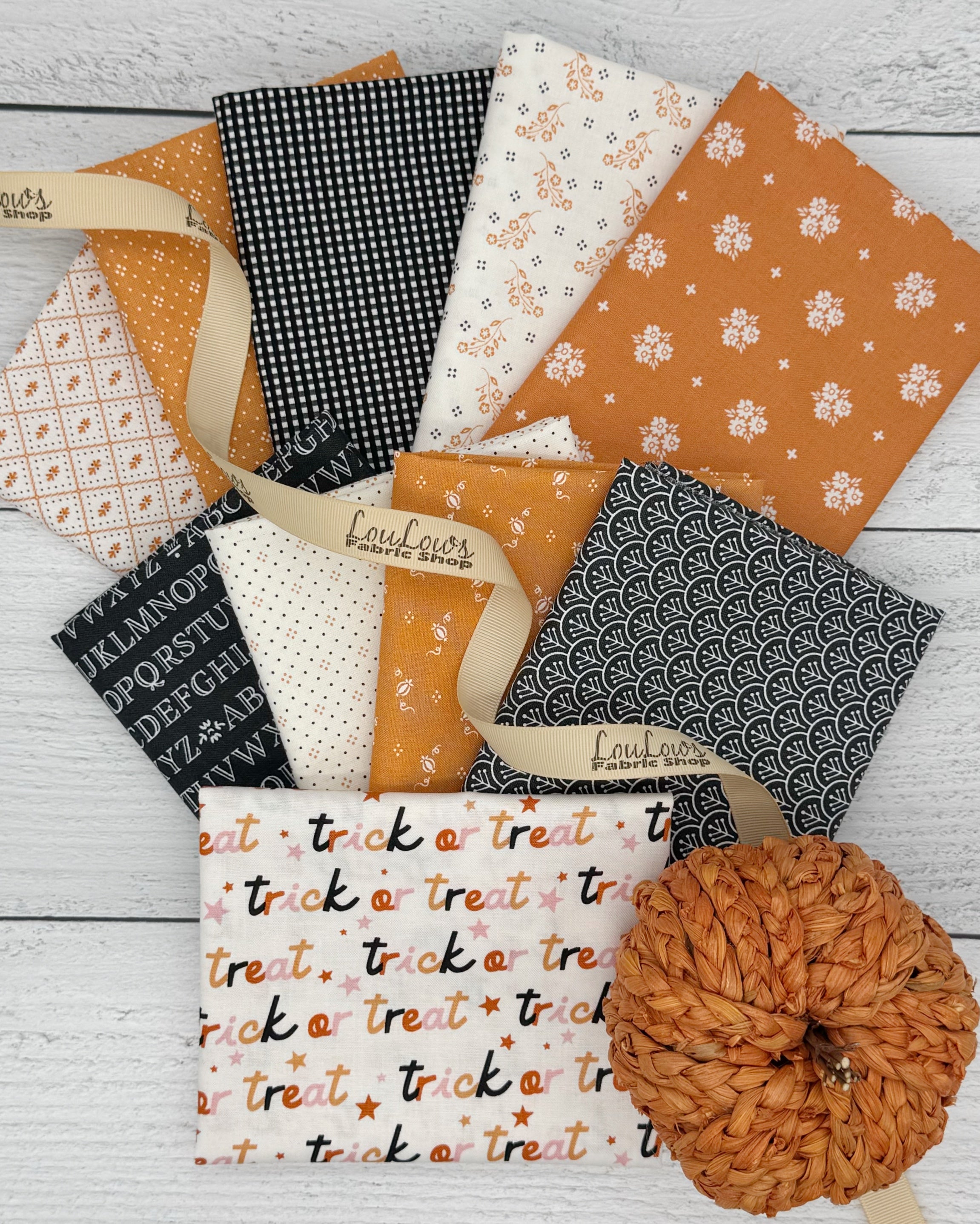 Collection of 10 cream, orange and black Halloween fat quarters