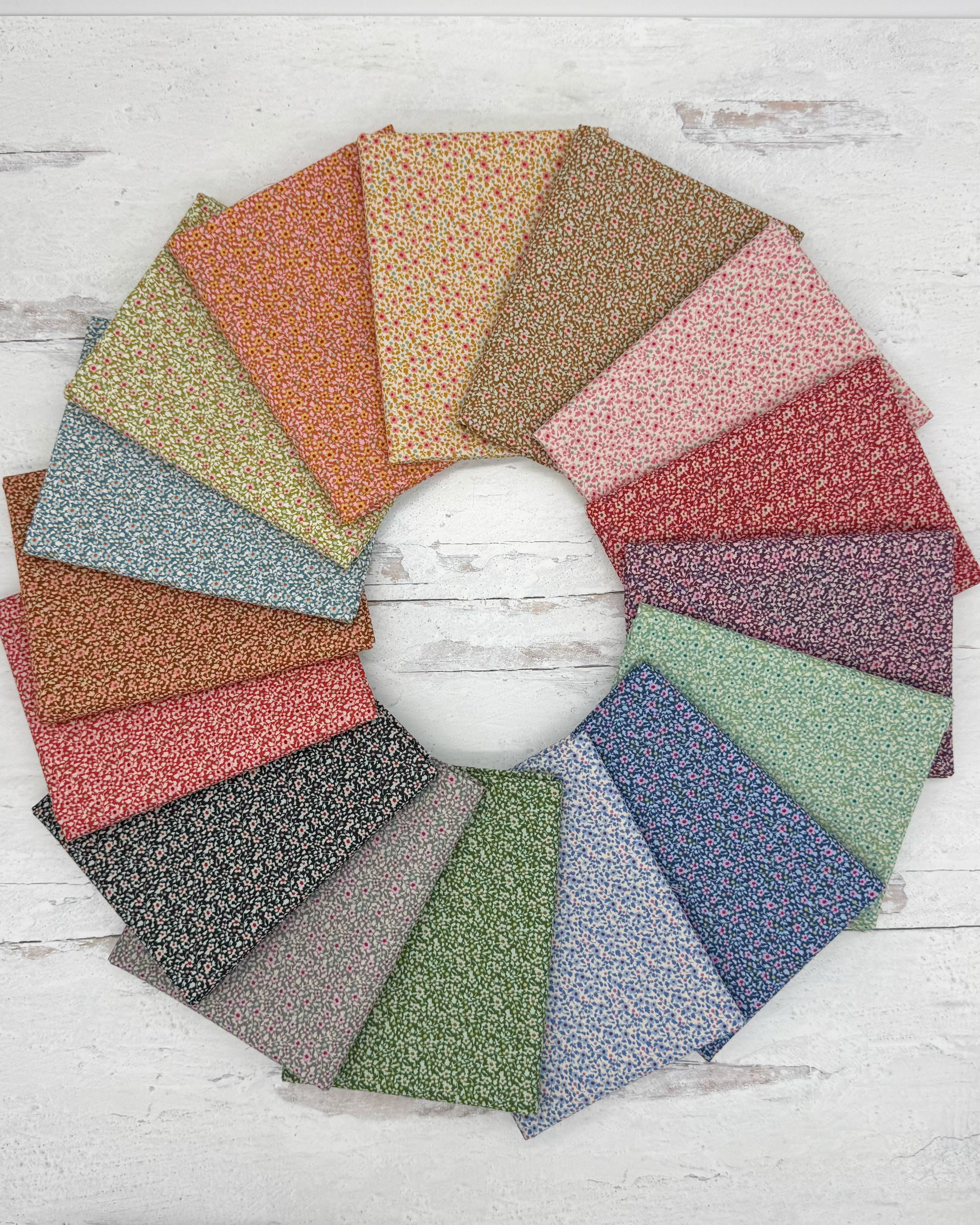 A variety of small floral prints in a muted color pallet.