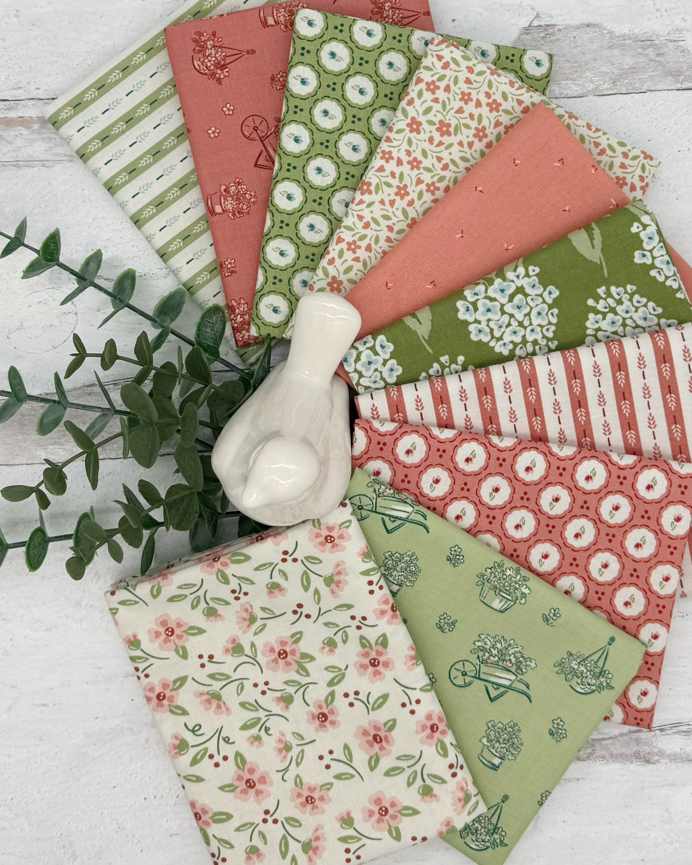 Collection of 10 garden themed fat quarters in soft greens, blush pinks, deep corals and creams. 