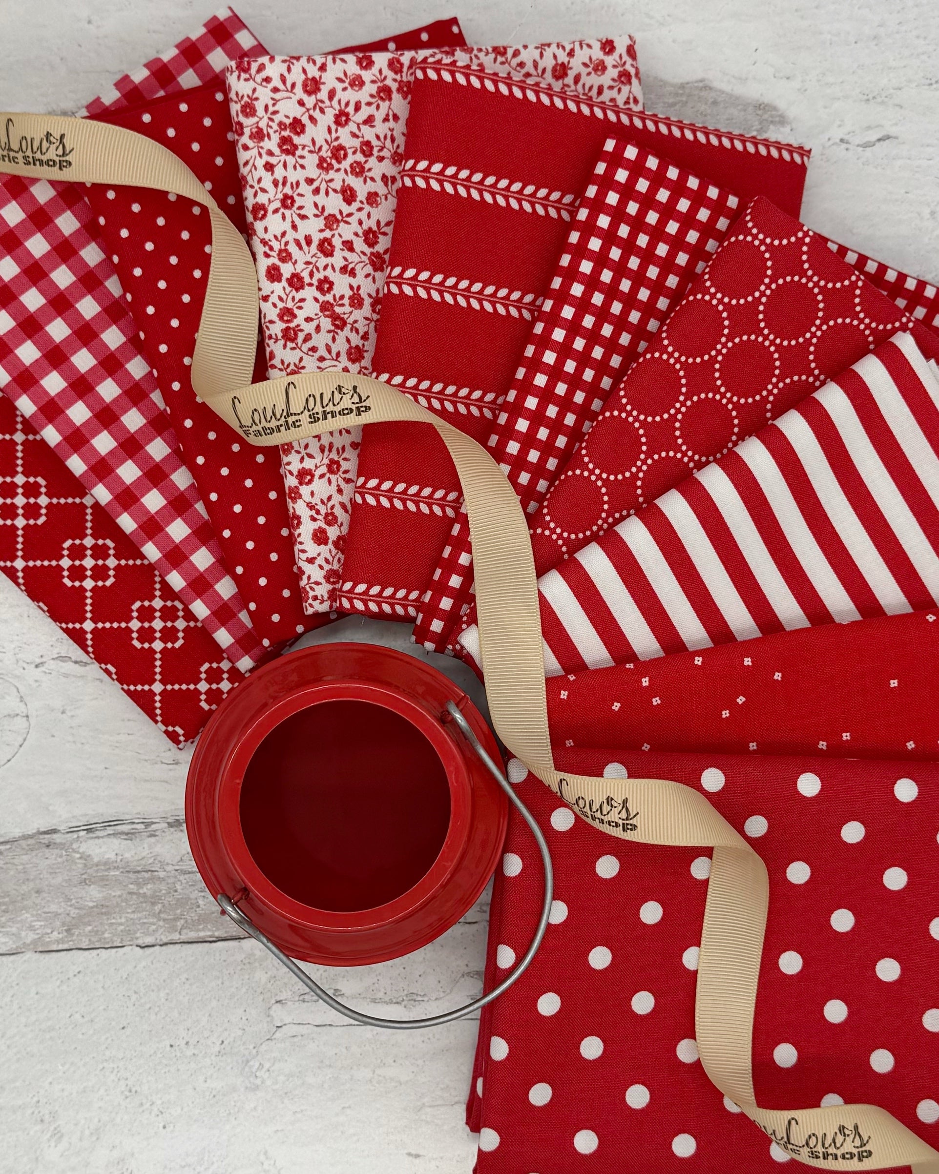10 Classic red fat quarters with dots, geometrics, florals, stripes and ginghams. 