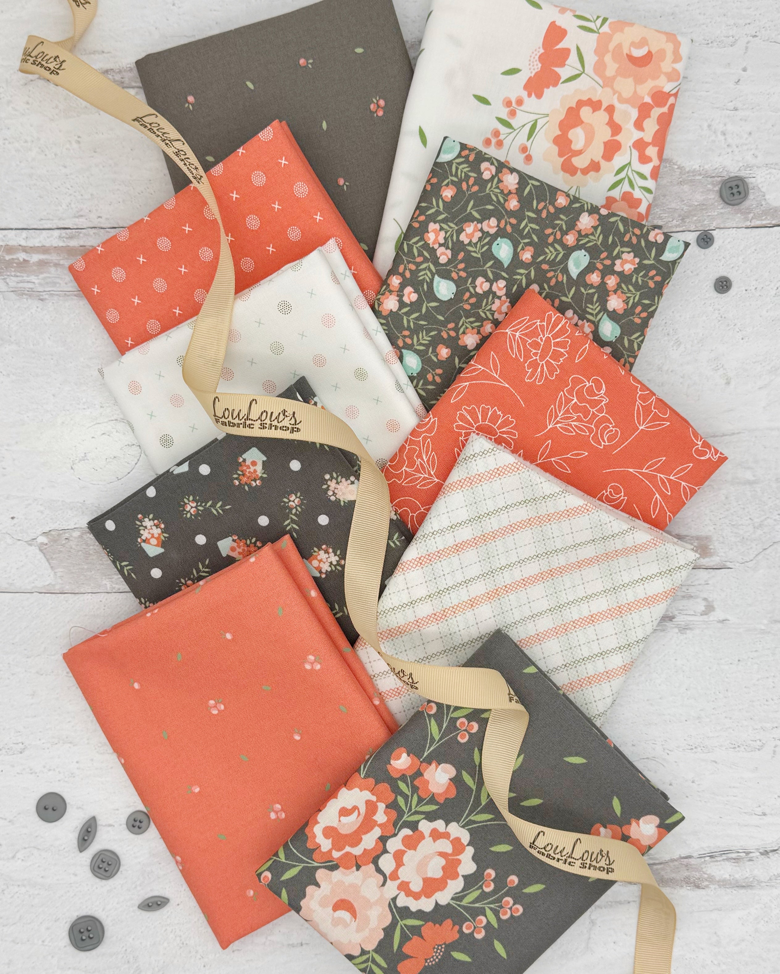 10 fat quarters in greys, corals and whites. Patterns range from florals to geometrics. 