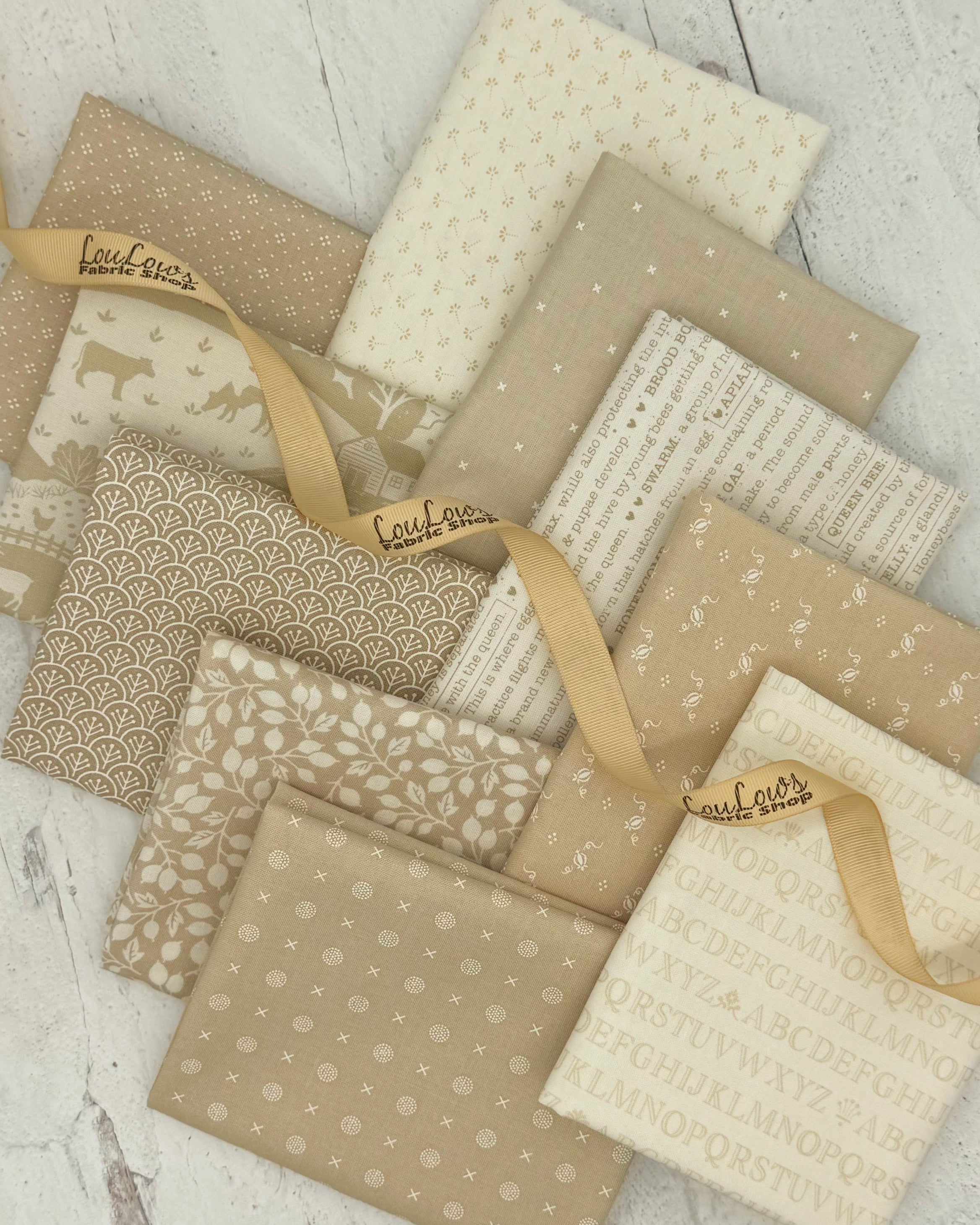 10 fat quarters in various low volume prints with either a soft taupe or ivory background. 