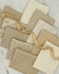 10 fat quarters in various low volume prints with either a soft taupe or ivory background. 