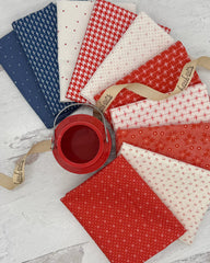 10 fat quarters- 2 blue, 4 red and 4 off white with small red details. 