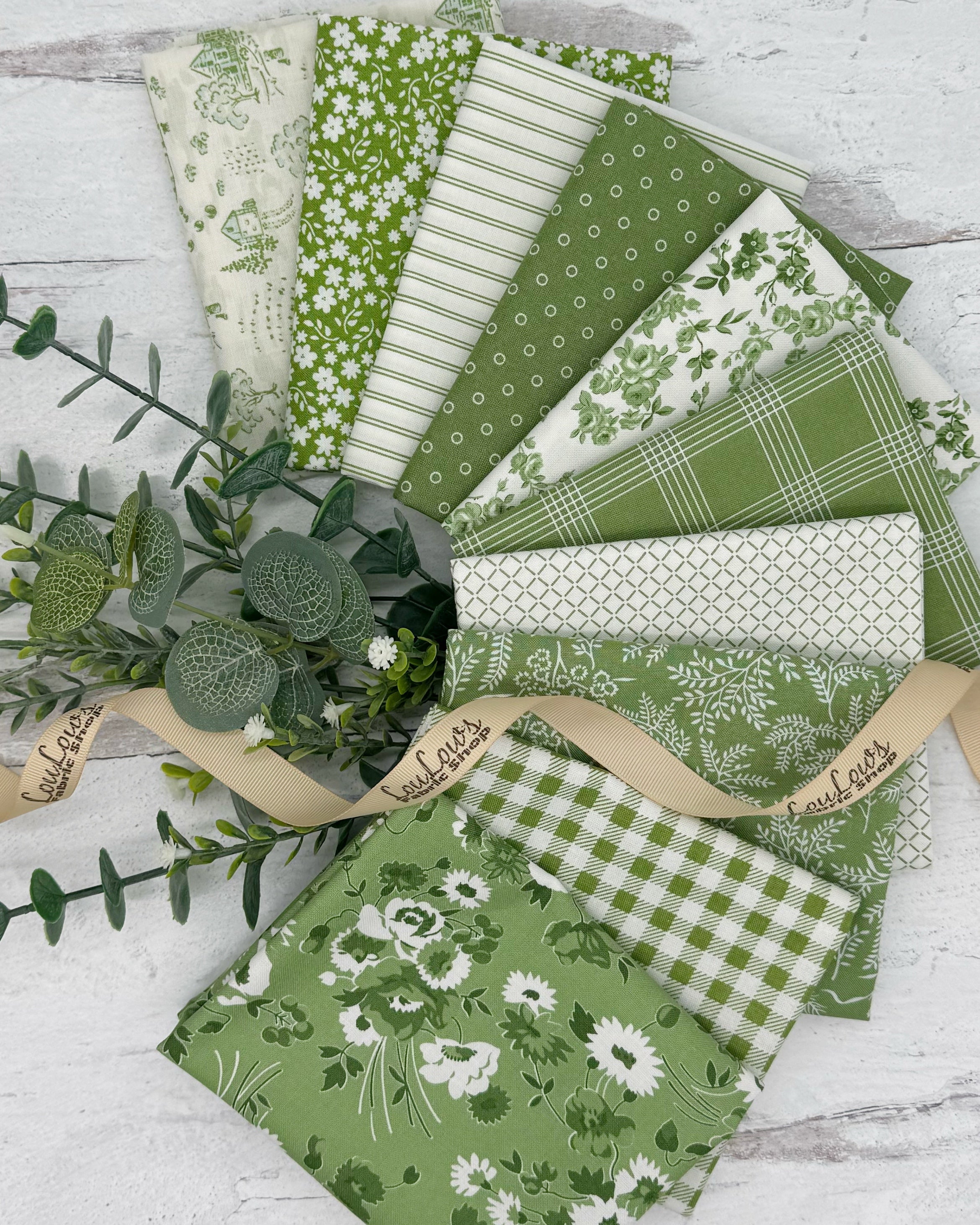 10 Fat quarters in fresh spring greens and off whites with floral, geometric and gingham prints. 