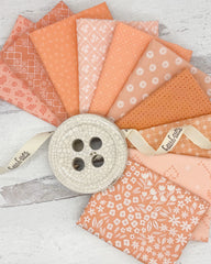 10 fat quarters in a variety of peachy and salmon colors with geometrics, florals and dots. 