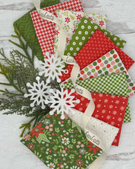 Collection of Christmas inspired prints with bright reds, greens and off whites. 10 fat quarters 