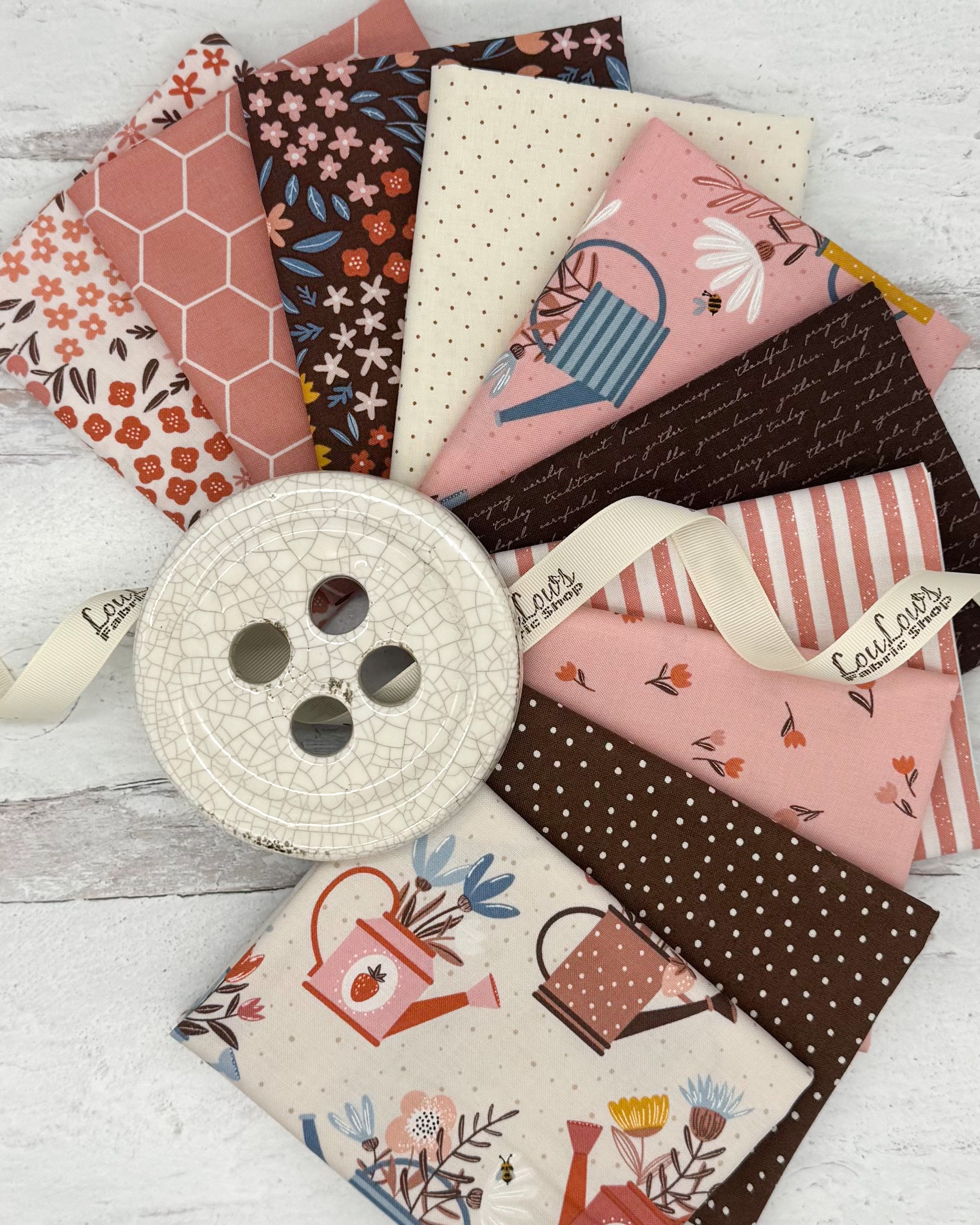 10 fat quarters with cream, dusty pink and chocolate brown backgrounds. Prints have a garden feel. 