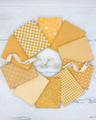 10 Sunshine yellow/golden fat quarters in a variety floral, gingham and dot prints. 