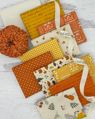Collection of 10 fat quarters all with a fall feel with background colors of cream, gold and orange. 