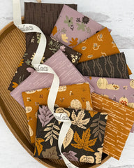 Collection of 10 fat quarters with background colors of a dark brown, lavender and deep gold. All with an outdoors/autumn theme.