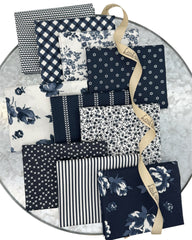10 fat quarters in dark midnight navys and creamy whites. Florals, stripes and geometrics. 