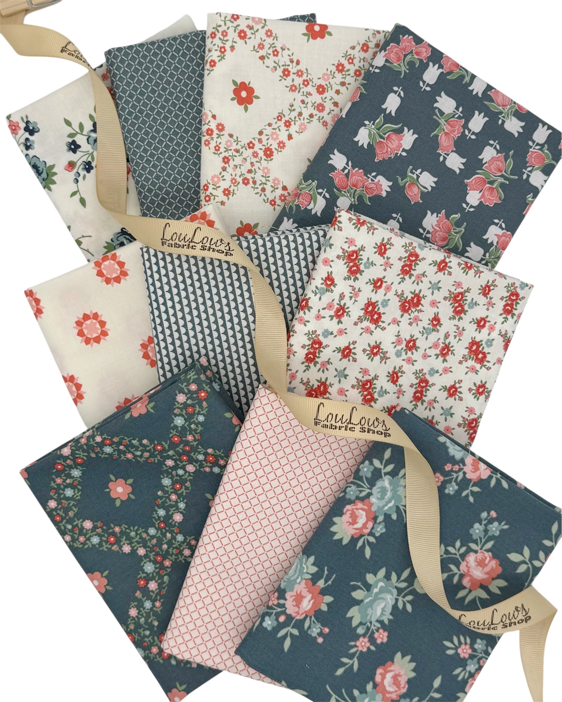 10 Fat Quarters in dusty blue, off white and pinks. Geometrics and florals 